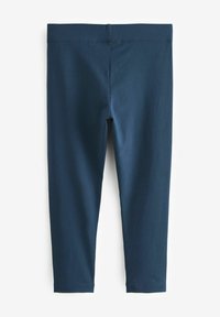 Leggings blu navy realizzati in un tessuto elastico e liscio. Presentano una vita ampia e un design aderente, che termina leggermente sopra la caviglia.