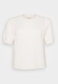 Μπλούζα κοντομάνικη σε κρέμ χρώμα, κατασκευασμένη από μαλακό ύφασμα. Διαθέτει στρογγυλή λαιμόκοψη και διακριτικά φουσκωτά μανίκια για πρόσθετο όγκο.