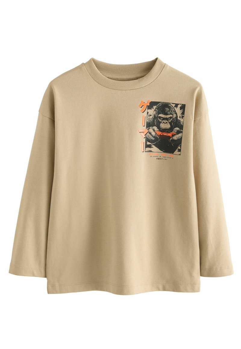 Beige long-sleeve t-shirt with ribbed neckline. Features a graphic print of a gorilla holding a game controller, with orange text accents.
