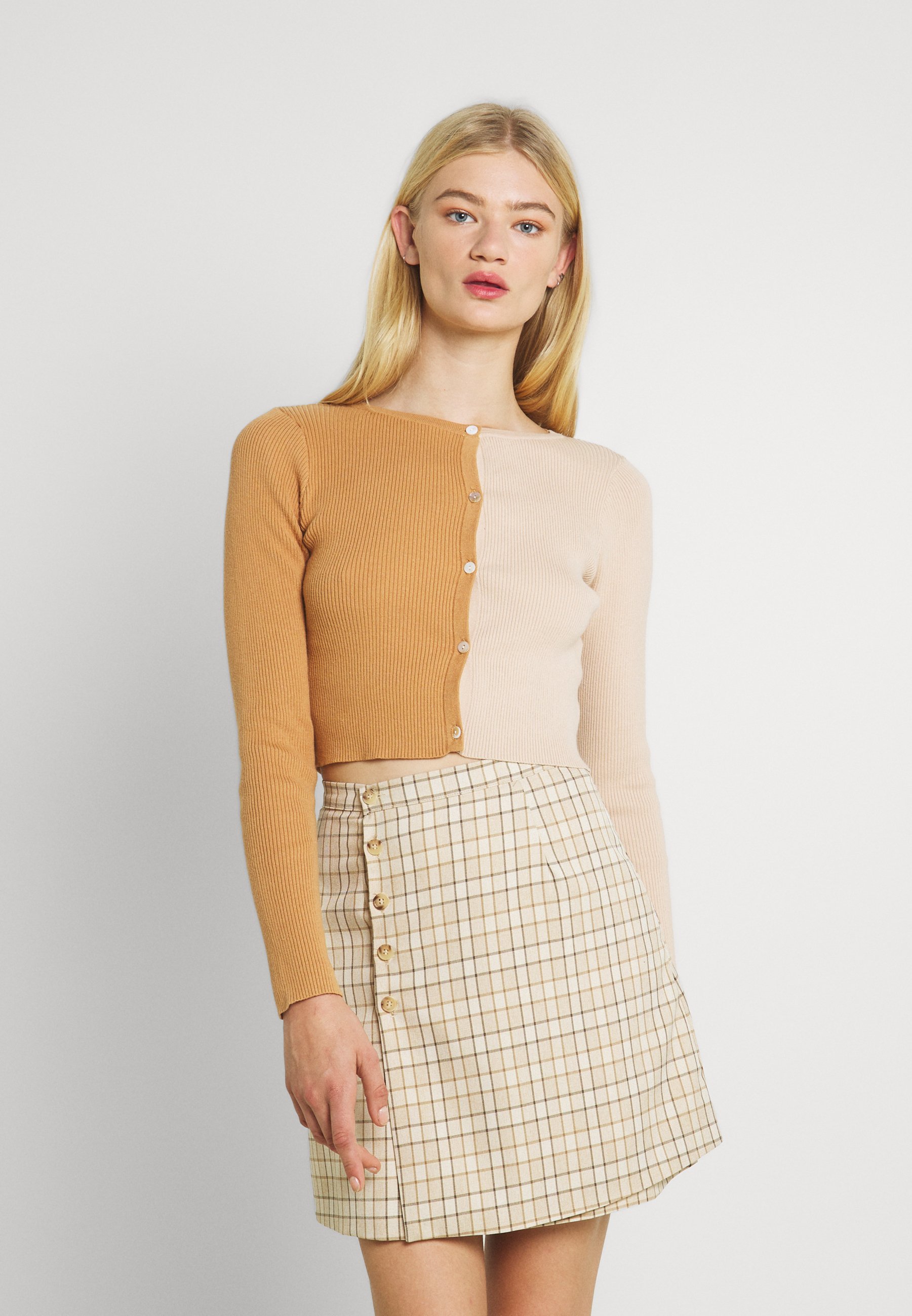 beige colour cardigan
