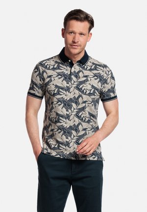 Heren poloshirt met korte mouwen in crème met een marineblauw bladpatroon, contrasterende marineblauwe kraag en drie-knops sluiting. Katoenmix, casual pasvorm.
