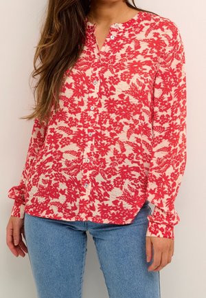Rotes und cremefarbenes Blumenshirt mit langen Ärmeln, Knopfleiste und Manschetten. Leichter Stoff mit lockerer Passform und abgerundetem Saum.