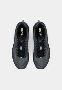 Gray athletic shoes featuring a mesh upper, black laces, and blue accents. Thick rubber sole with textured grip and pull tab for easy wear.