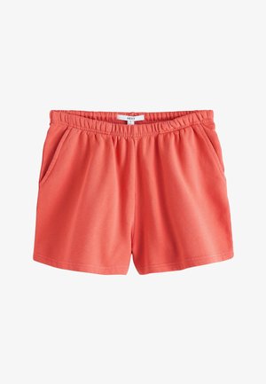 Lachsfarbene, legere Shorts mit elastischem Bund, Seitentaschen und Größenschild mit der Aufschrift "Next S" auf weißem Hintergrund.