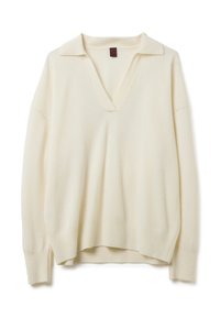 Pull crème avec un décolleté en V, col court, coupe décontractée, ourlet côtelé et texture douce. Fabriqué en matériau léger.