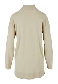 Beige neule, jossa on korkea kaulus, pitkät hihat, ribbitetyt hihansuut ja helma. Kangas näyttää pehmeältä, siinä on sileä pinta ja vähäinen kiilto.
