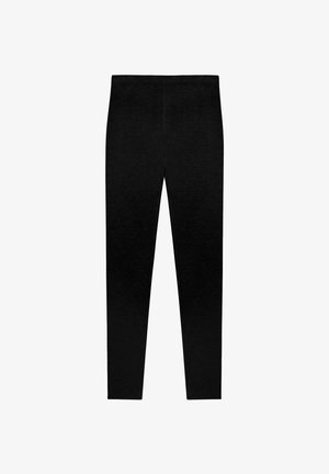 Schwarze Leggings aus einem weichen, dehnbaren Stoff. Sie haben einen hoch geschnittenen Bund und ein nahtloses Design mit einer schmalen, taillierten Passform.