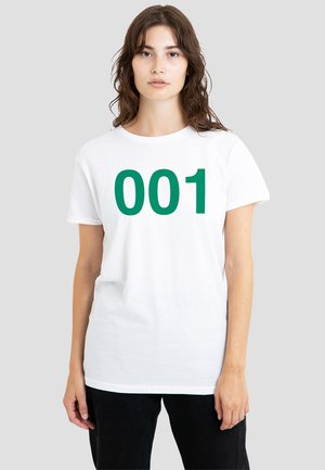 White cotton T-shirt featuring a large green "001" printed on the front. Short sleeves and a relaxed fit. Simple design with no additional embellishments.