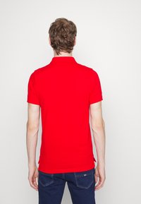 Tommy Jeans SLIM PLACKET - Polo - deep crimson