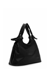 Black textured leather handbag with two tied strap accents. Soft, slouchy shape and single opening at the top for easy access.