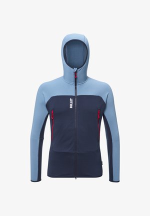 Kurtka z kapturem w jasnoniebieskim i granatowym kolorze, z zapinanymi na zamek kieszeniami na piersi, teksturowanym materiałem oraz kontrastowymi akcentami wzdłuż zamka i szwów.