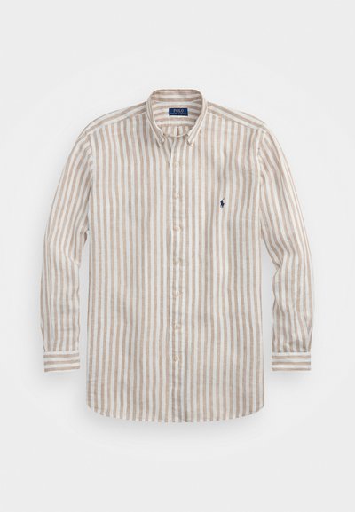 Beige ja valge triibuline pikakä sleeves särg, nööpidega krae, mille rinnal on väike sinine logo ja sirge äärega. Puuvilla-lina segu.