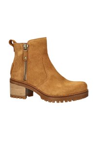 Tan suede ankle boot with a side zipper and a small heel. Features stitched accents and a textured rubber outsole for traction.