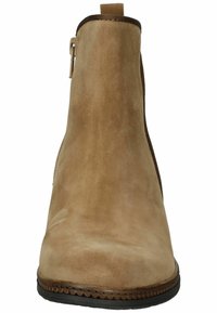 Bottine en suède beige avec une finition lisse, fermeture éclair sur le côté et bout arrondi. Dispose d'une semelle texturée pour une meilleure adhérence. Design classique de hauteur intermédiaire.