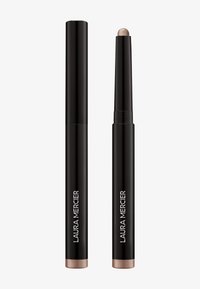 Laura Mercier oogschaduwstick in zwarte verpakking met een metallic uiteinde. De structuur is cilindrisch en heeft een gladde, matte textuur.