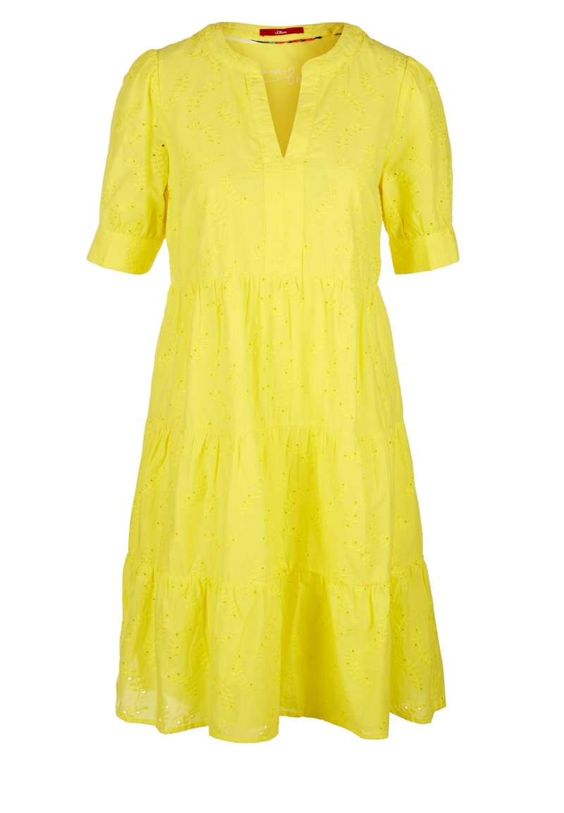 Żółta bawełniana sukienka z krótkimi rękawami, głębokim dekoltem w kształcie litery V i warstwową spódnicą. Posiada kwiatowe hafty i luźny krój.