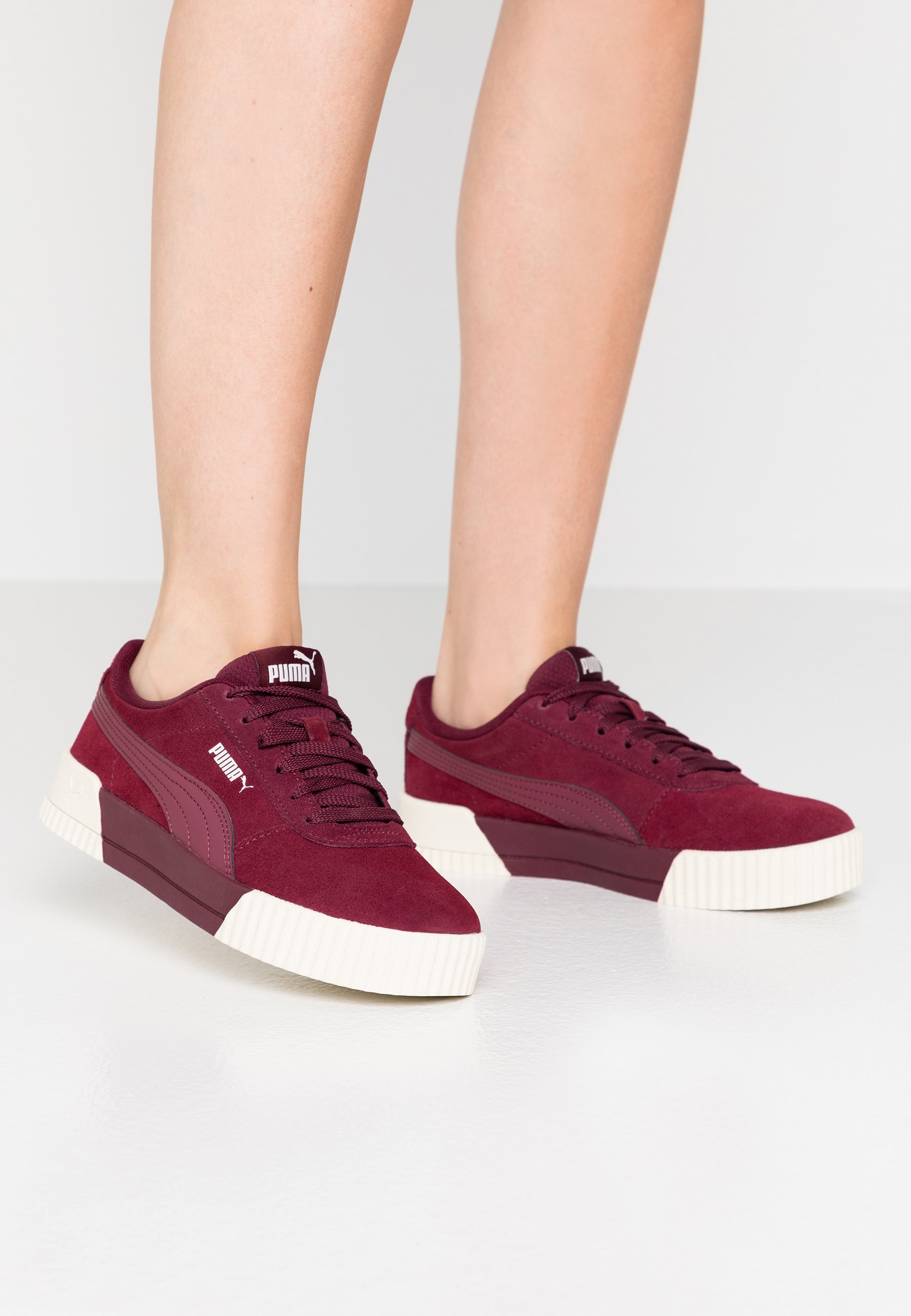 burgundy and white pumas