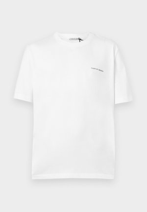 White short-sleeve crew neck T-shirt with small "Tiger of Sweden" text logo on the left chest.