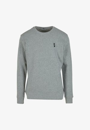 Hallhalli hallhäältš švets, mis on valmistatud puuvillasegistusest, ümarate kaelustega, soonikkoes mansettide ja väikese musta logo kujutisega, millel on risti sümbol rinnal.