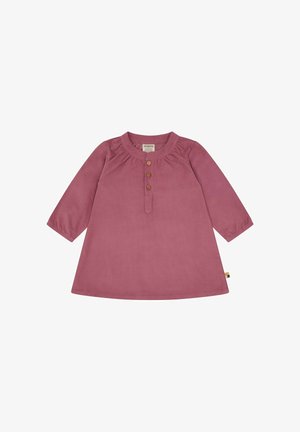 Roze corduroy jurk met lange mouwen, ronde hals en drie houten knopen aan de voorkant. Beschikt over gerimpelde details bij de halslijn.
