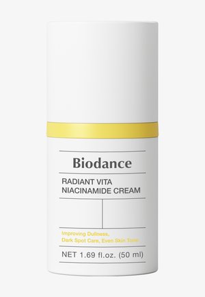 Biodance Radiant Vita Niacinamide -voidepullo keltaisella korkkirenkaalla, 50 ml, himmeyden, tummien läiskien hoitoon ja tasaisen ihon sävyn parantamiseen.