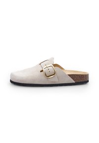 Light beige suede clog with a closed toe, featuring a gold metal buckle and a contoured cork footbed, set on a black rubber sole.