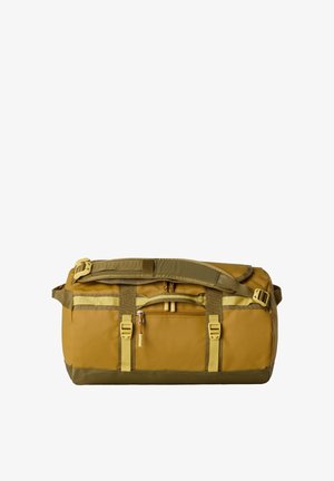 Torba sportowa w żółtym kolorze z zielonymi akcentami, wyposażona w górny uchwyt, regulowany pasek oraz zewnętrzną kieszeń na zamek dla wygody.