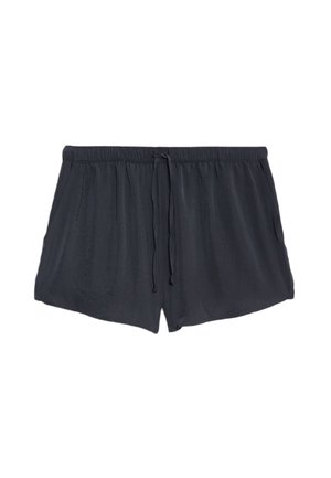 Pantalones cortos negros de tela ligera, con una cinturilla elástica con cordón y bolsillos laterales. Textura suave y corte relajado.