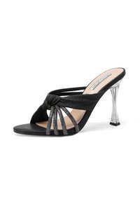 Sandali neri con tacco, caratterizzati da un design con nodo frontale, cinturini glitterati e un tacco a forma conica trasparente. Texture in suede con una soletta liscia.