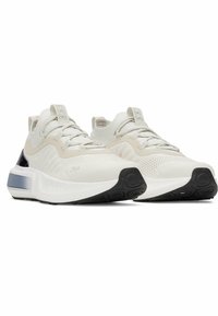Lightweight athletic shoes with a white mesh upper, cream accents, and a black rubber sole. Features a secure lace-up closure and textured detailing.