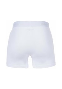 Boxer in cotone bianco con un morbido girovita elastico e un logo "Marc O'Polo" grigio chiaro. Texture liscia, design a gamba corta.