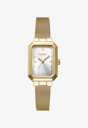 Orologio DKNY con cassa ottagonale dorata, quadrante argento e bracciale in maglia dorata. Presenta indicatori minimalisti e due piccoli cristalli all'altezza delle sei.
