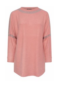 Vaaleanpunainen pitkähihainen paita, jossa on pyöreä pääntie, hopeiset koristelut olkasaumojen kohdalla sekä rento istuvuus ja käännetyt hihansuut.