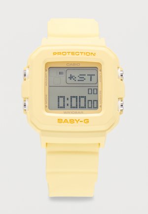 Montre digitale Casio Baby-G jaune avec affichage carré montrant le mode chronomètre à 0:00.00 et bracelet en caoutchouc jaune.