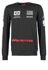 Felpa nera a maniche lunghe con vari design grafici, tra cui testo, Snoopy e motivo a zigzag rosso sull'orlo e sulle maniche.