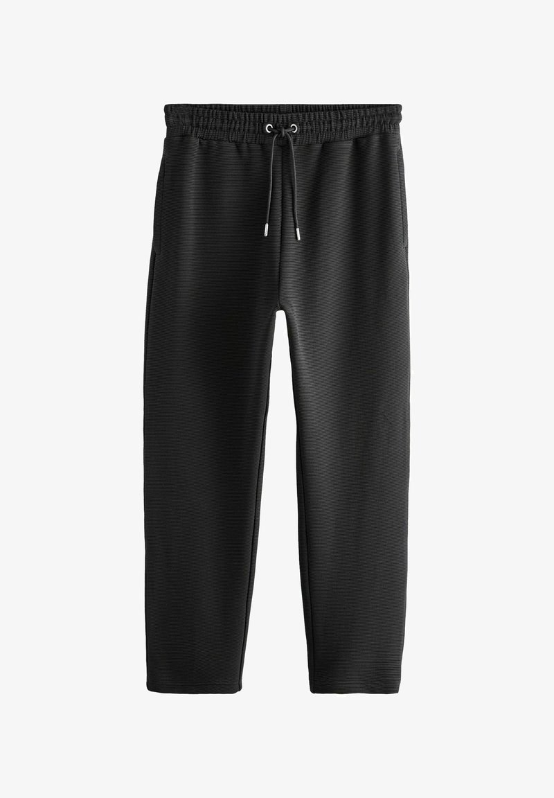 Black sweatpants made of textured fabric, featuring an elastic waistband with drawstring, side pockets, and tapered legs.