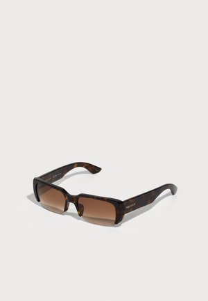 Tortoiseshell sunglasses with brown tinted lenses, rectangular shape, and thick frame. Features subtle logo detailing on the arm.
