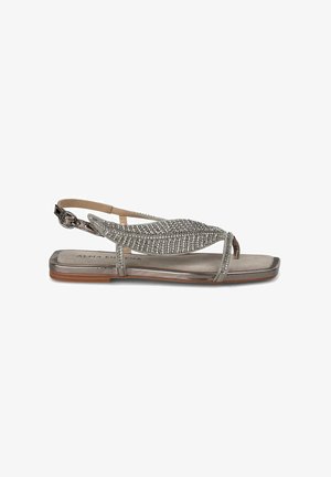 Flat sandal in metallic silver with a rhinestone-embellished design. Features an open toe and adjustable slingback strap. Smooth matte footbed.