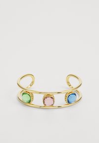 Gold metal cuff bracelet featuring three oval stones: green, pink, and blue. Smooth finish with textured settings for stones.