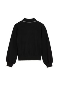 Cardigan noir en maille avec un col à revers, des manches bouffantes et une couture blanche texturée le long du col et de l'ourlet.