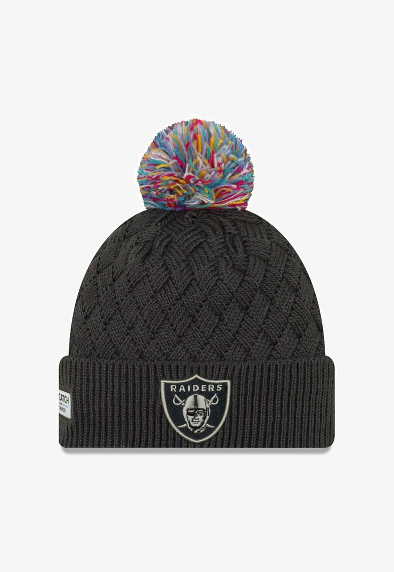 Knitted black beanie with a colorful pom-pom on top, featuring a Raiders logo patch on the front and ribbed cuff at the base.