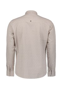 Lange mouwen shirt in licht beige met een geometrisch patroon. Knop-down kraag, enkele knoopmanchet en rughalsdetail.