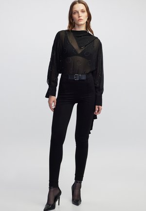 WITH BELT BUCKLE - Pantalones - black