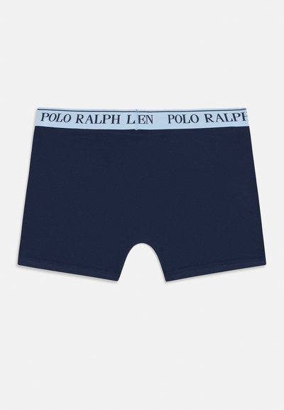 Navy blue bombaške hlače iz bombaža z svetlo modrim elastičnim pasom, na katerem je črnen napis "POLO RALPH LAUREN". Gladka tekstura, brez vzorcev.