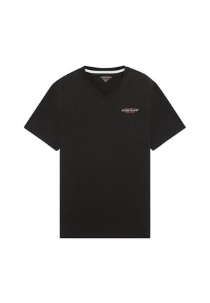 Mustat puuvillapaidat, joissa on V-aukkoinen kaula-aukko. Rinnassa on pieni punainen ja valkoinen "Guess Jeans" -logo. Lyhyet hihat ja normaali istuvuus.