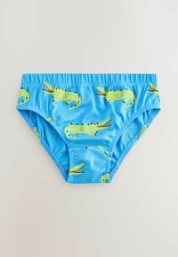 Costume da bagno blu con motivo coccodrillo. Realizzato in tessuto liscio, presenta un elastico in vita e disegni di coccodrillo verdi stampati.