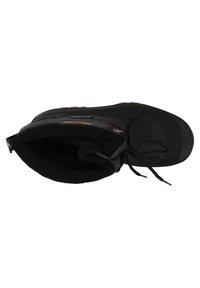 Black insulated winter boot with lace closure, textured sole, and fleece-lined interior, shown from top view.