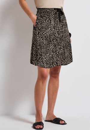 Leopardmönstrad kjol i beige och svart, lättviktig tyg, knä-lång, med elastisk midja och dragsko, samt sidofickor.