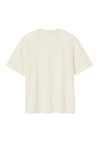 T-shirt à manches courtes couleur crème avec un col rond, texture lisse et coupe décontractée. Aucun motif ou accent visible.