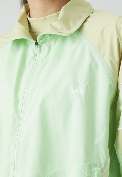 adidas by Stella McCartney TRACKTOP - Training jacket - glow green/halo gold
